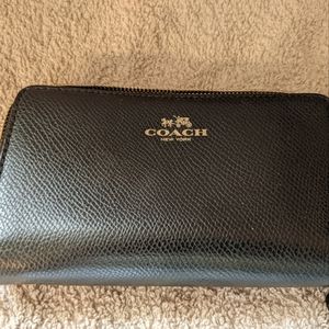 Coach black leather wallet, with gold zippers and